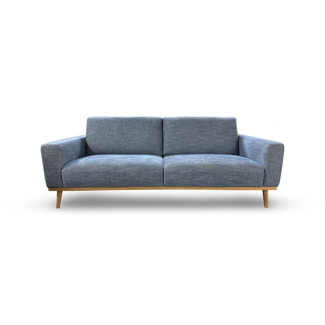 Blue Lucy Sofa seen from the front on a white background