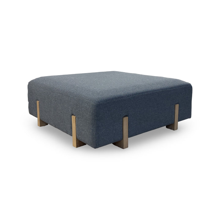 Blue Sonoma Cocktail Ottoman seen from the side on a white background